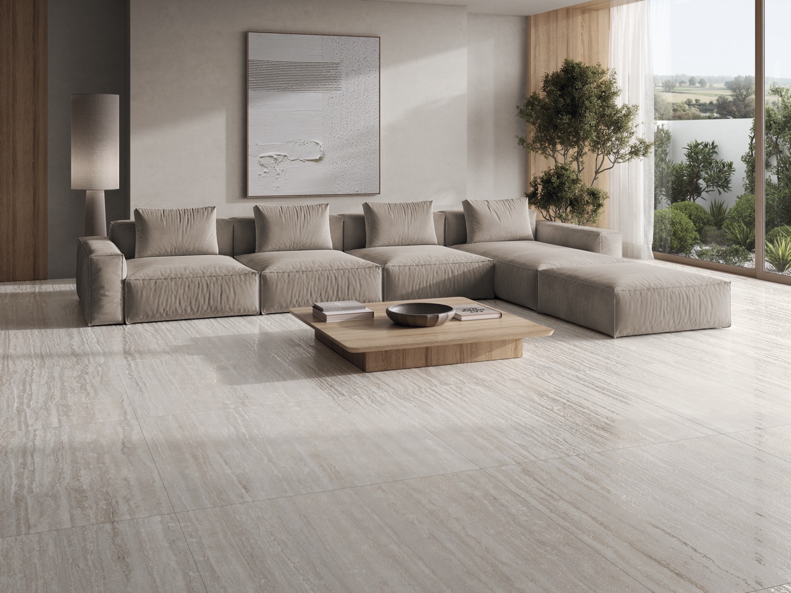 Salón contemporáneo con sofá modular y pavimento porcelánico de gran formato en tono claro