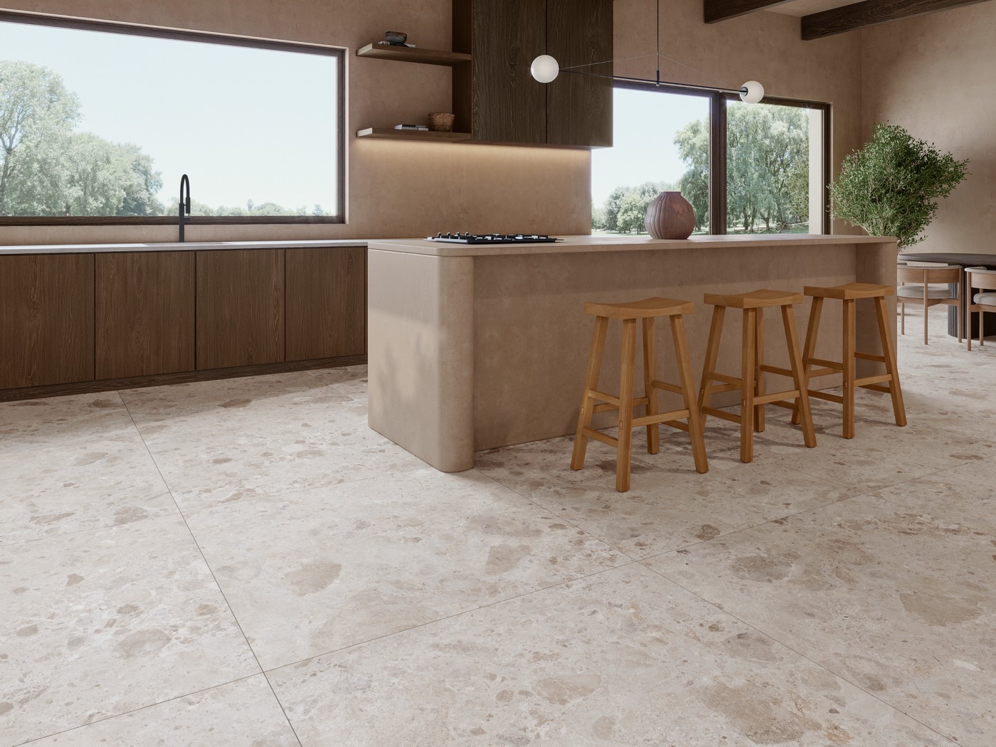 Cocina con isla y pavimento porcelánico efecto piedra de gran formato